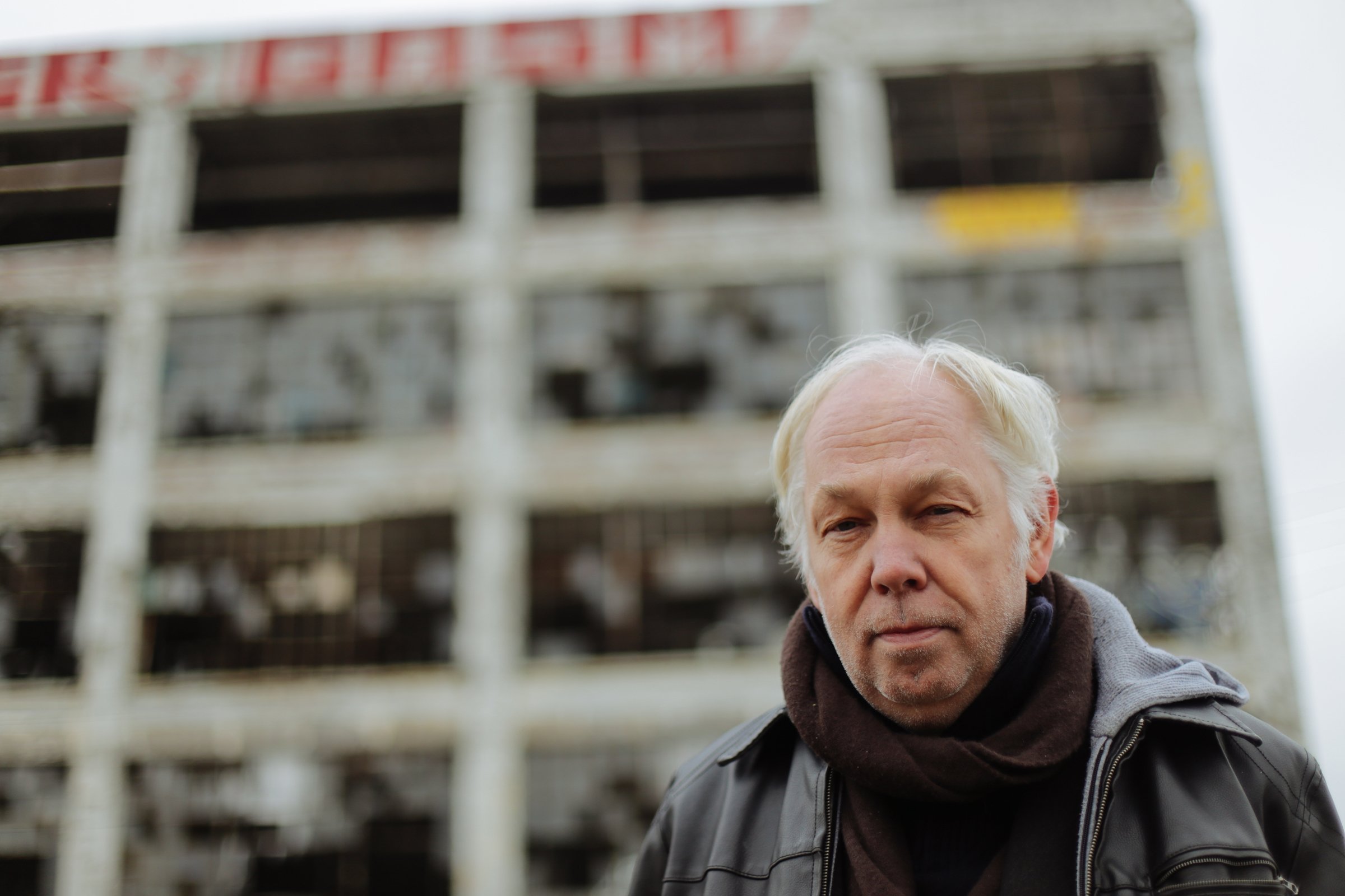 World-renowned Berlin club owner Dimitri Hegemann poses for a photo outside the vacant Fisher Body Plant No. 21 in Detroit on Wednesday November 26, 2014. Hegemann has proposed converting the building into a techno club and community center.